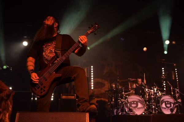 Bassist Johny Chow of Stone Sour plays with one foot straddling the foldback at the Hordern Pavilion.