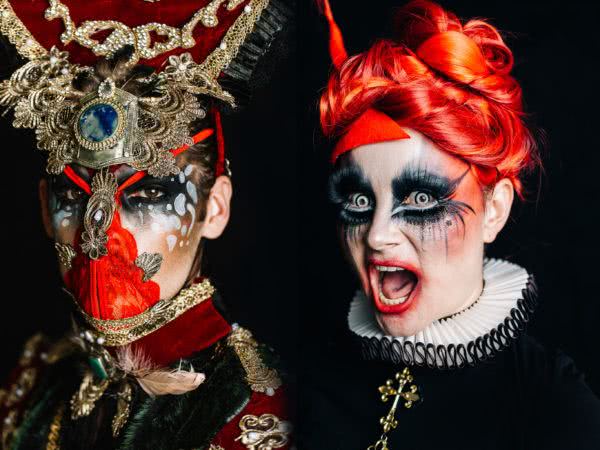 Two heavily costumed performers posing for Heaps Gay's Masqueerade event