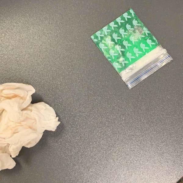Image of a bloody tissue and bag of meth found in a coat bought from a Melbourne Target store