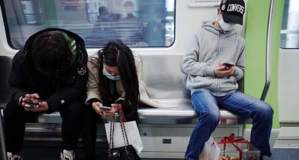 Coronavirus masks on people with iphones